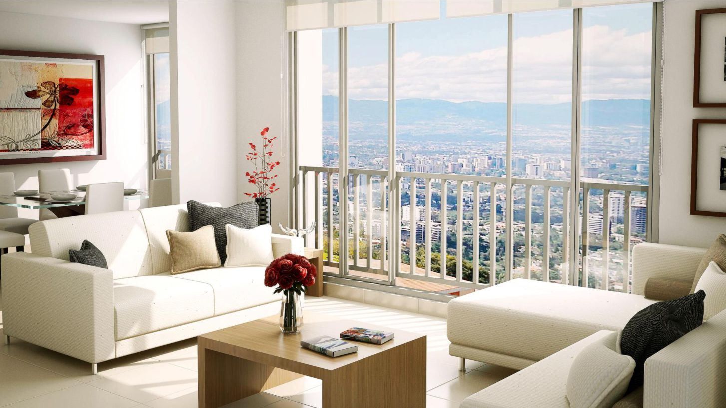 Sala con ventanal del apartamento modelo